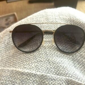 Barton Perreira Justice Sunglasses
Black lenses champagne frames